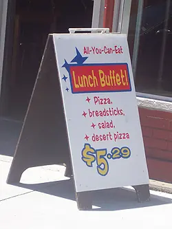 Illustrated sidewalk sandwich board advertising a lunch buffet