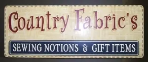 Painted Country Fabrics wall sign